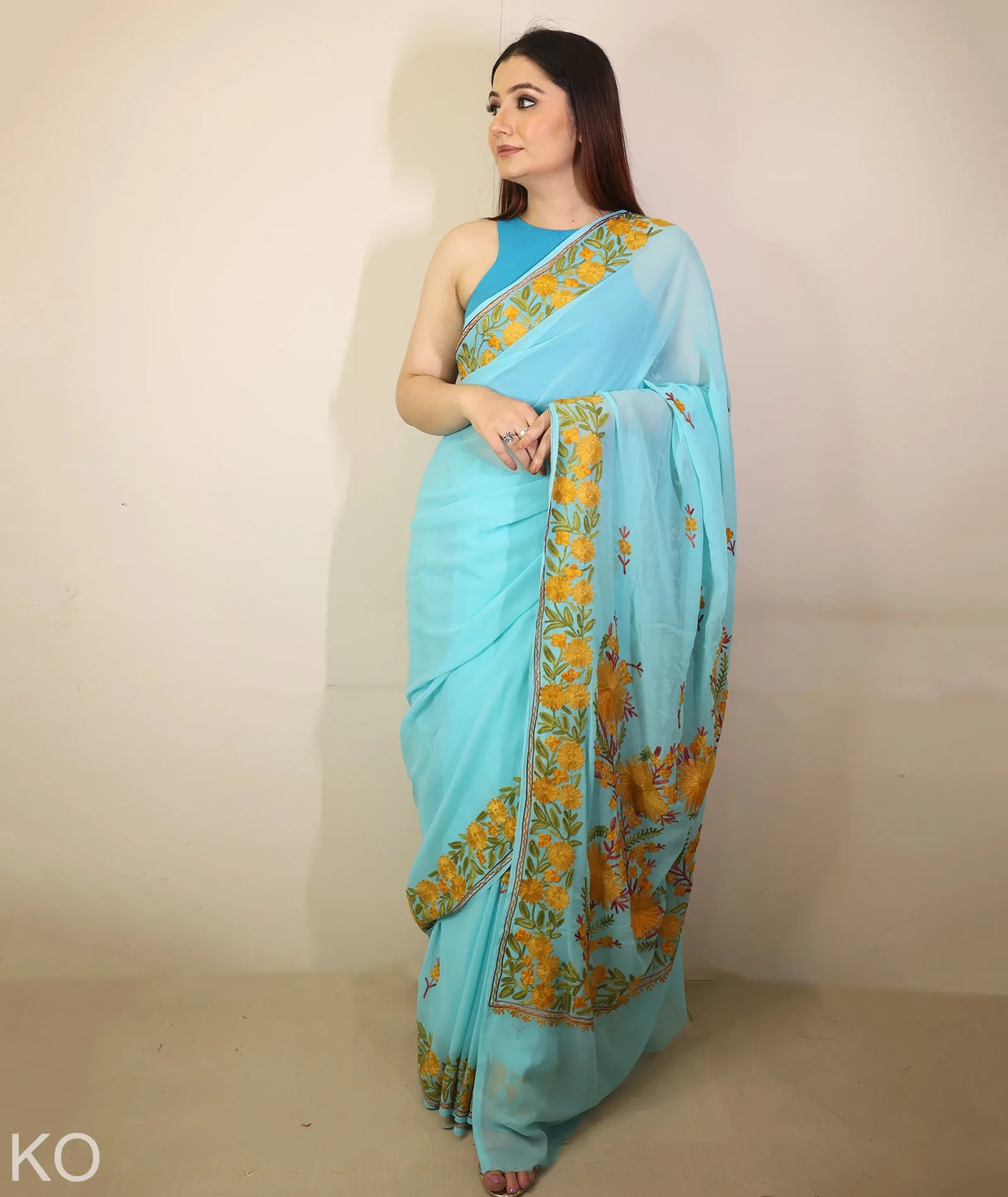 Turquoise Embroidered Georgette Saree