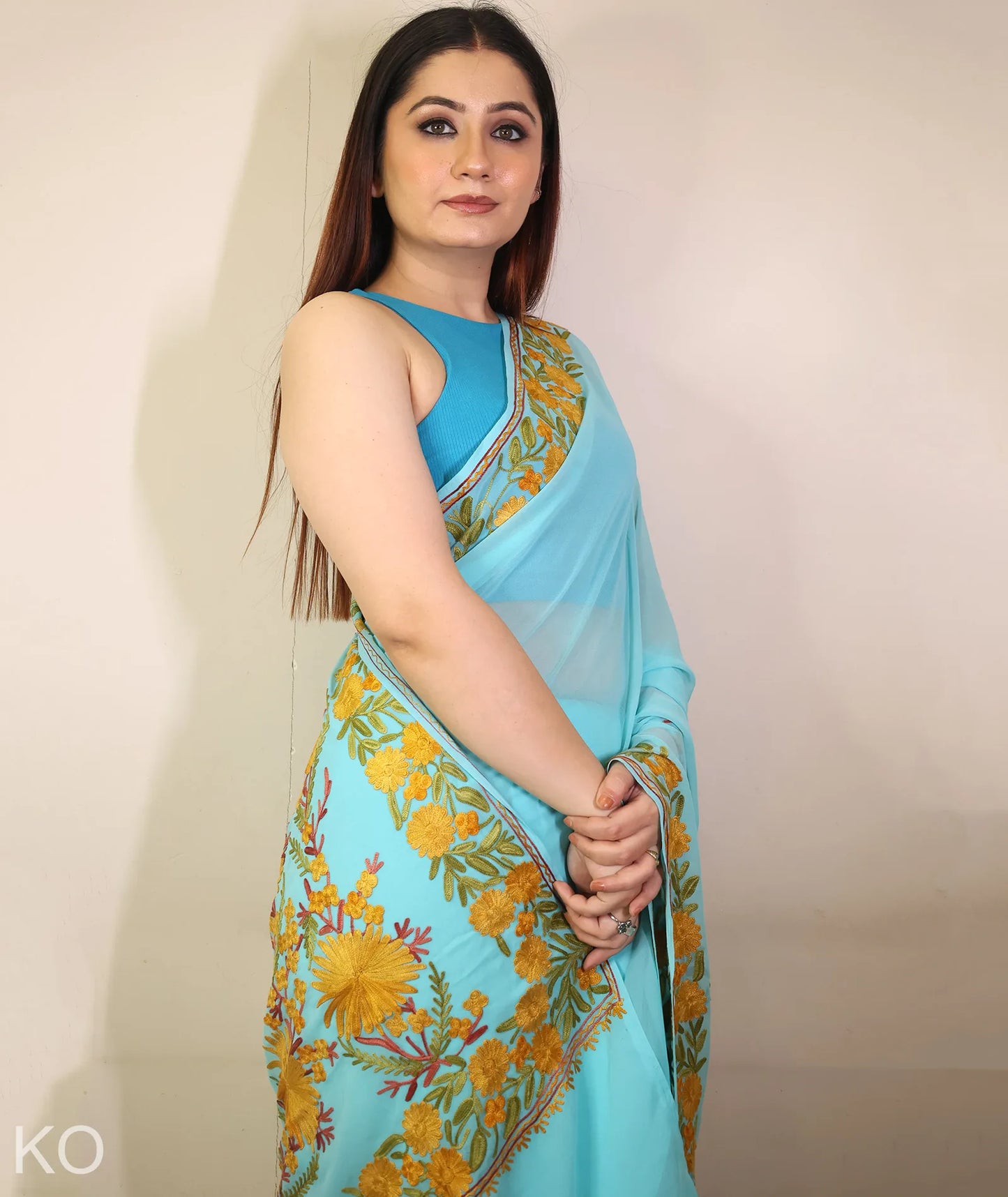 Turquoise Embroidered Georgette Saree